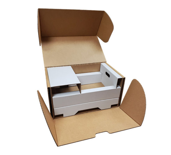 A big industrial box containing a two tiered insert designed to protect electronics